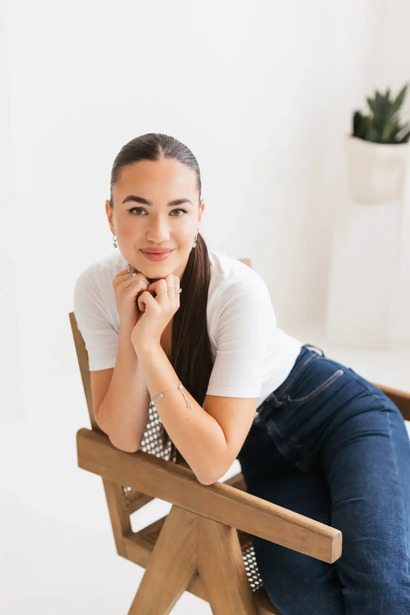 Erika Hudacova smiling, chin resting on her hand